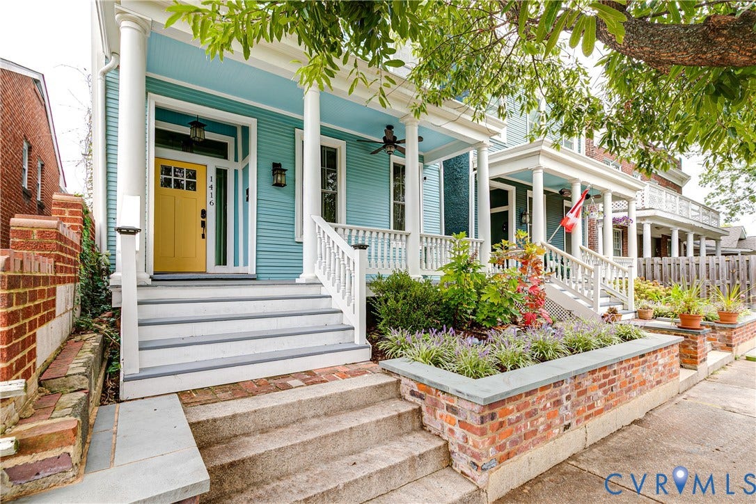1416 Oakwood Avenue, Church Hill, Richmond, VA 23223 Exterior featuring a covered porch, white columns, a vibrant yellow entry door, and a brick planter