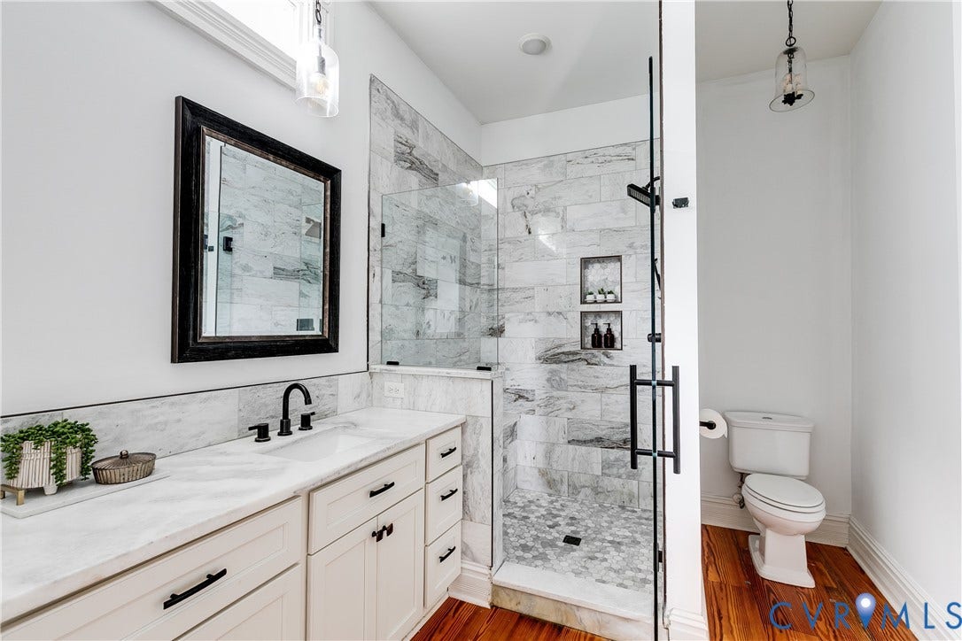 1416 Oakwood Avenue, Church Hill, Richmond, VA 23223 White vanity cabinetry with matte black hardware and a white countertop