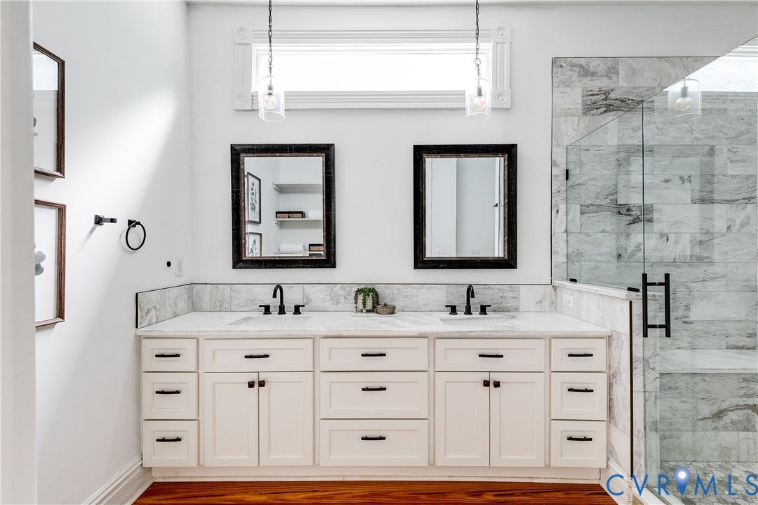 1416 Oakwood Avenue, Church Hill, Richmond, VA 23223 Dual vanity with white cabinetry, matte black fixtures, and a tiled shower with a glass enclosure