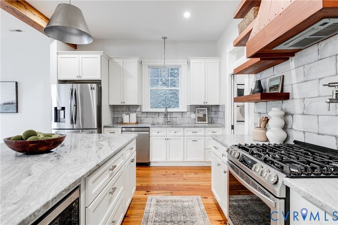 1416 Oakwood Avenue, Church Hill, Richmond, VA 23223 White cabinetry with stainless steel appliances, light-toned countertops, and wood-finish flooring