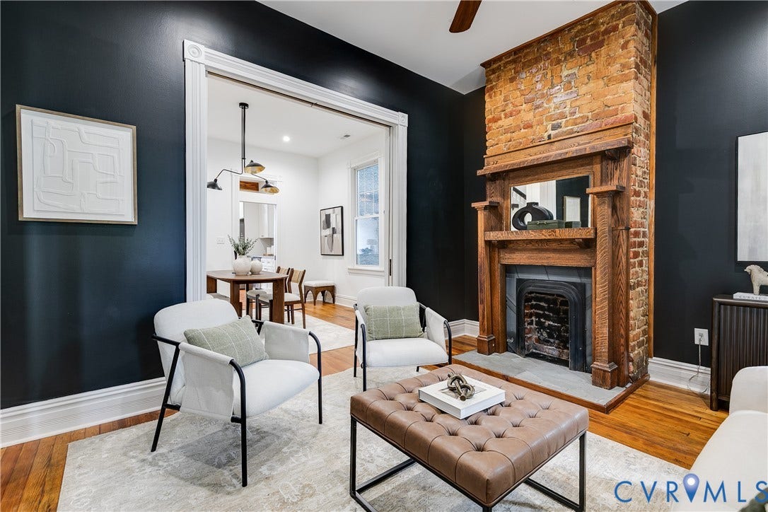 1416 Oakwood Avenue, Church Hill, Richmond, VA 23223 Exposed brick fireplace with a wood mantel, wood-finish flooring, and white trim