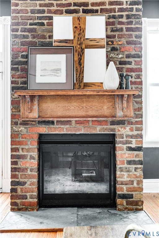 1416 Oakwood Avenue, Church Hill, Richmond, VA 23223 Brick fireplace with a wood mantle, black firebox, and stone hearth