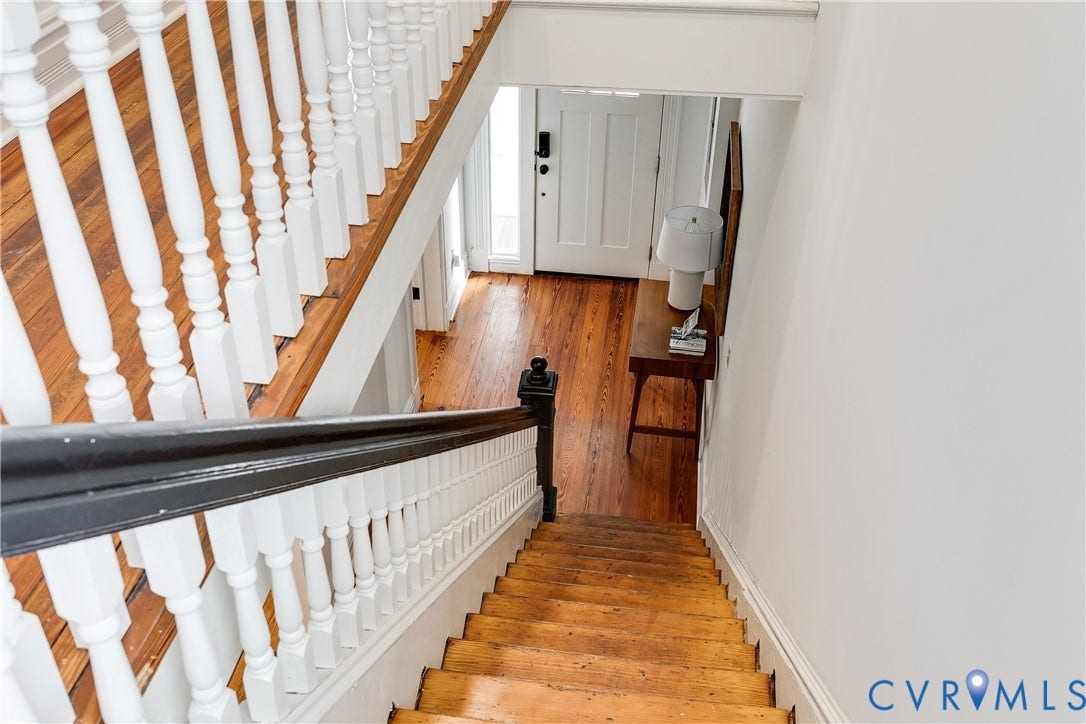 1416 Oakwood Avenue, Church Hill, Richmond, VA 23223 Hardwood treads and white balusters with dark wood handrail, leading to a front door with sidelight