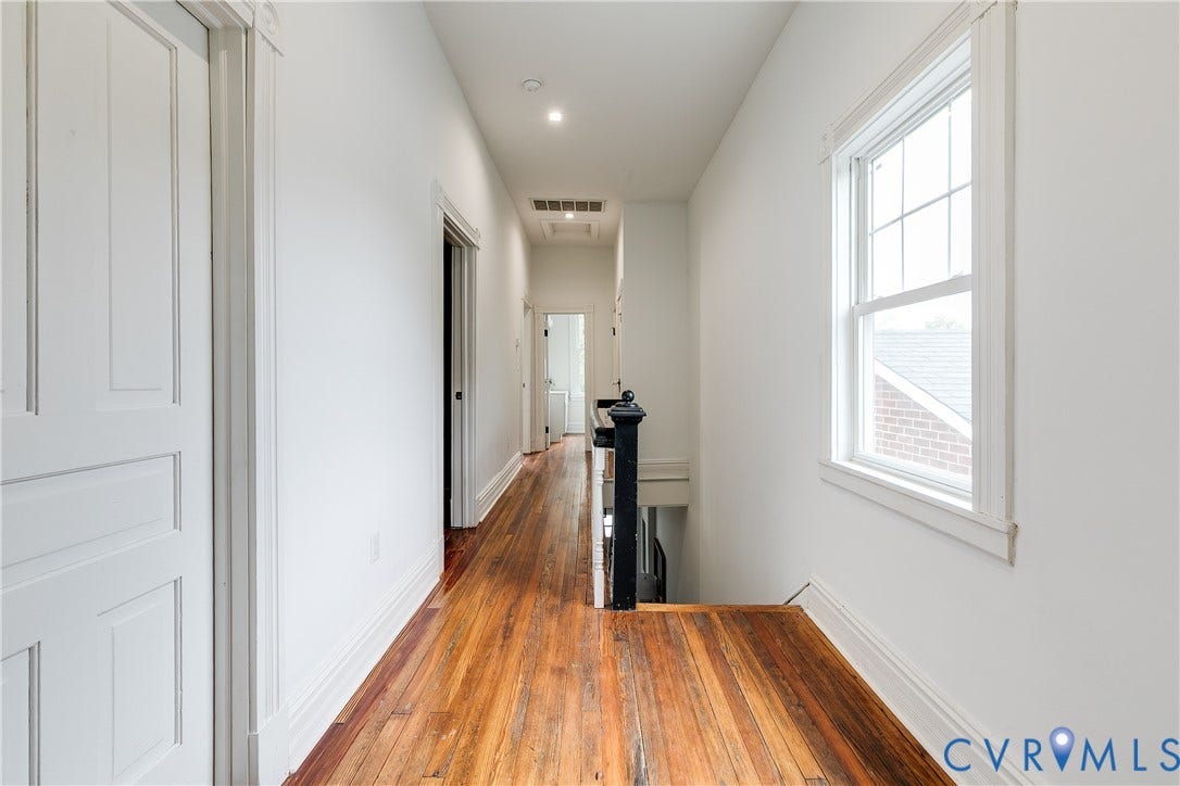 1416 Oakwood Avenue, Church Hill, Richmond, VA 23223 Hardwood flooring throughout, bright white walls, recessed lighting, white paneled doors, and a paneled window