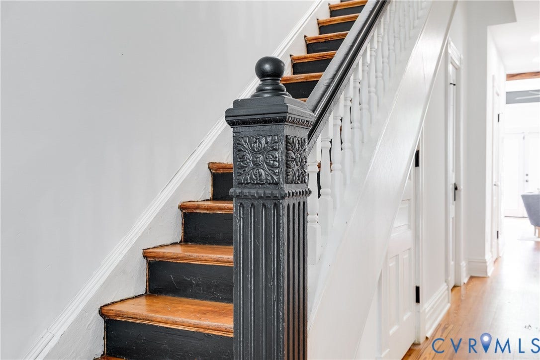 1416 Oakwood Avenue, Church Hill, Richmond, VA 23223 Staircase featuring a decorative newel post, wood treads, painted risers, and white balusters