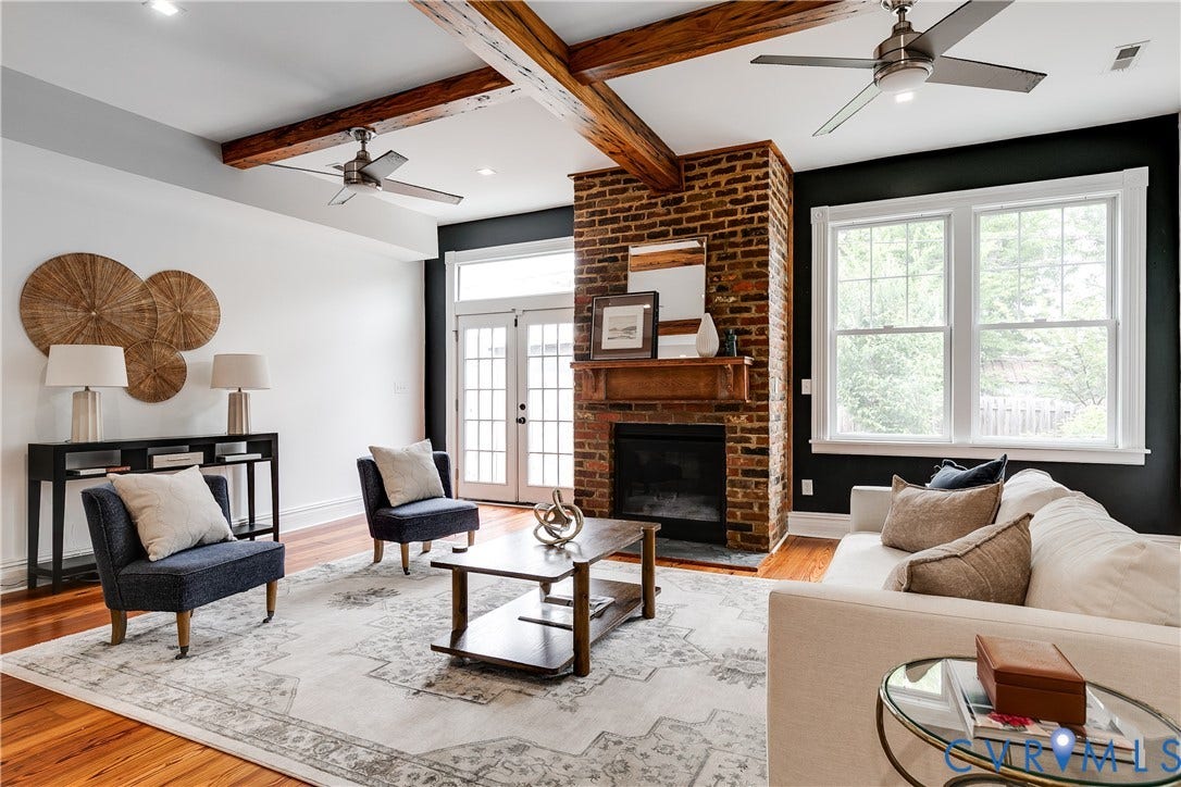 1416 Oakwood Avenue, Church Hill, Richmond, VA 23223 Hardwood flooring, exposed ceiling beams, brick fireplace with wood mantel, white french doors, and multiple windows