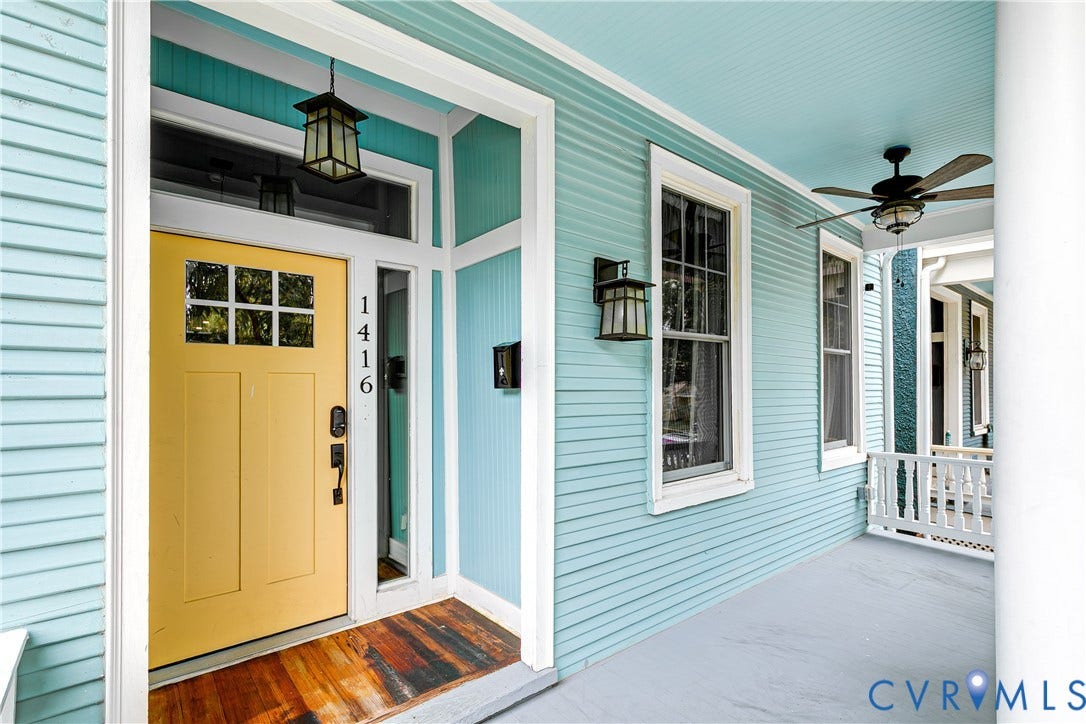 1416 Oakwood Avenue, Church Hill, Richmond, VA 23223 Covered porch with light blue siding, a vibrant yellow entry door, white trim, and a ceiling fan