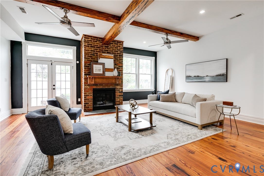1416 Oakwood Avenue, Church Hill, Richmond, VA 23223 Hardwood flooring throughout, exposed wood ceiling beams, brick fireplace with wood mantel, and French doors with transom window