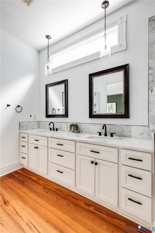1416 Oakwood Avenue, Church Hill, Richmond, VA 23223 Double vanity with white cabinetry, matte black hardware, and light-colored countertops