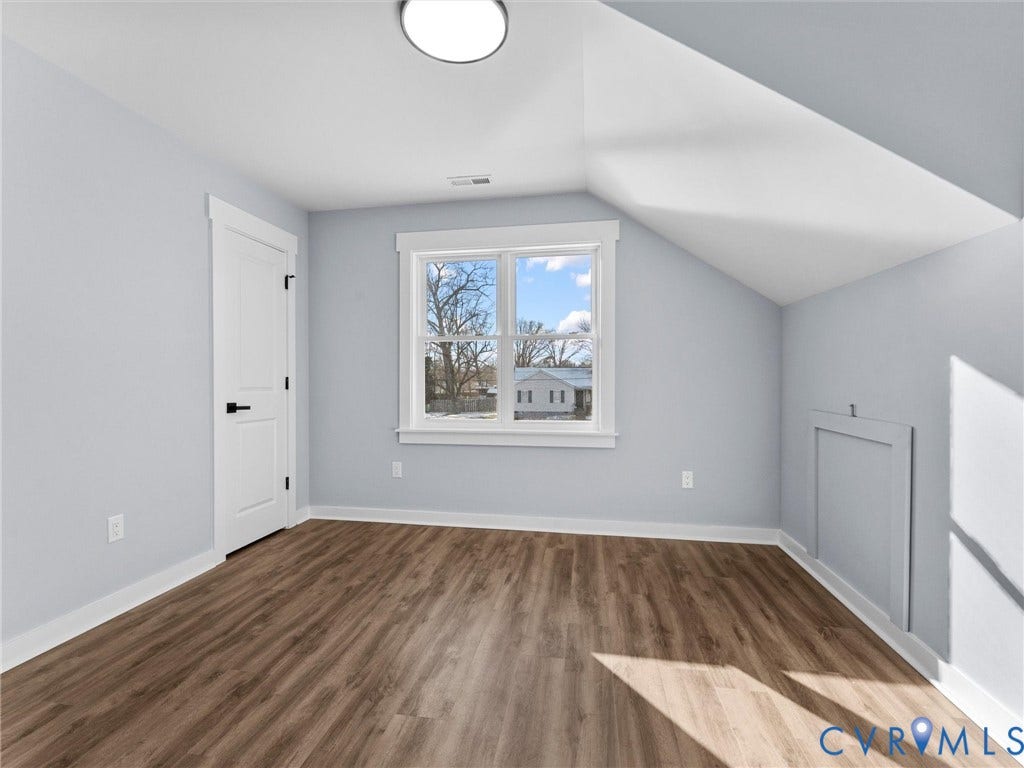 2719 General Boulevard, Chesterfield, VA 23237 Wood-finish flooring, light blue walls, white trim, and a window with natural light