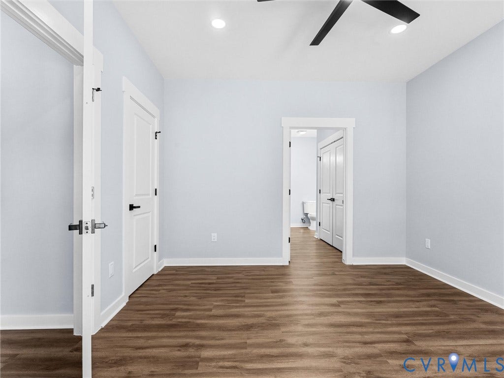 2719 General Boulevard, Chesterfield, VA 23237 Wood-finish flooring, white trim, recessed lighting, ceiling fan, and white interior doors with black hardware
