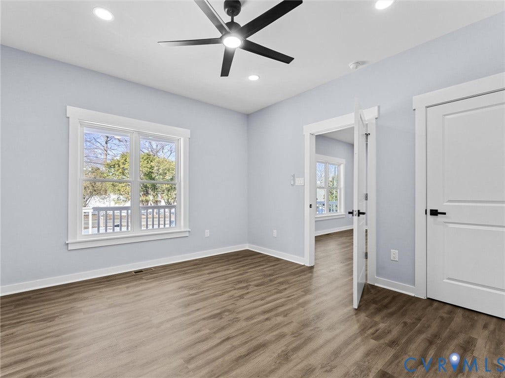 2719 General Boulevard, Chesterfield, VA 23237 Wood-finish flooring, recessed lighting, ceiling fan, white trim, and white paneled doors with matte black hardware