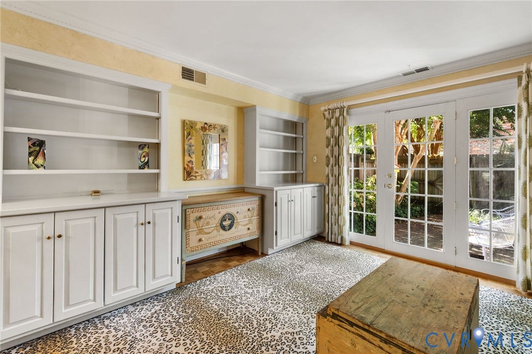 505 N Hamilton Street, #F, Richmond, VA 23221 Built-in cabinetry with integrated shelving, crown molding, and French doors leading to an exterior area