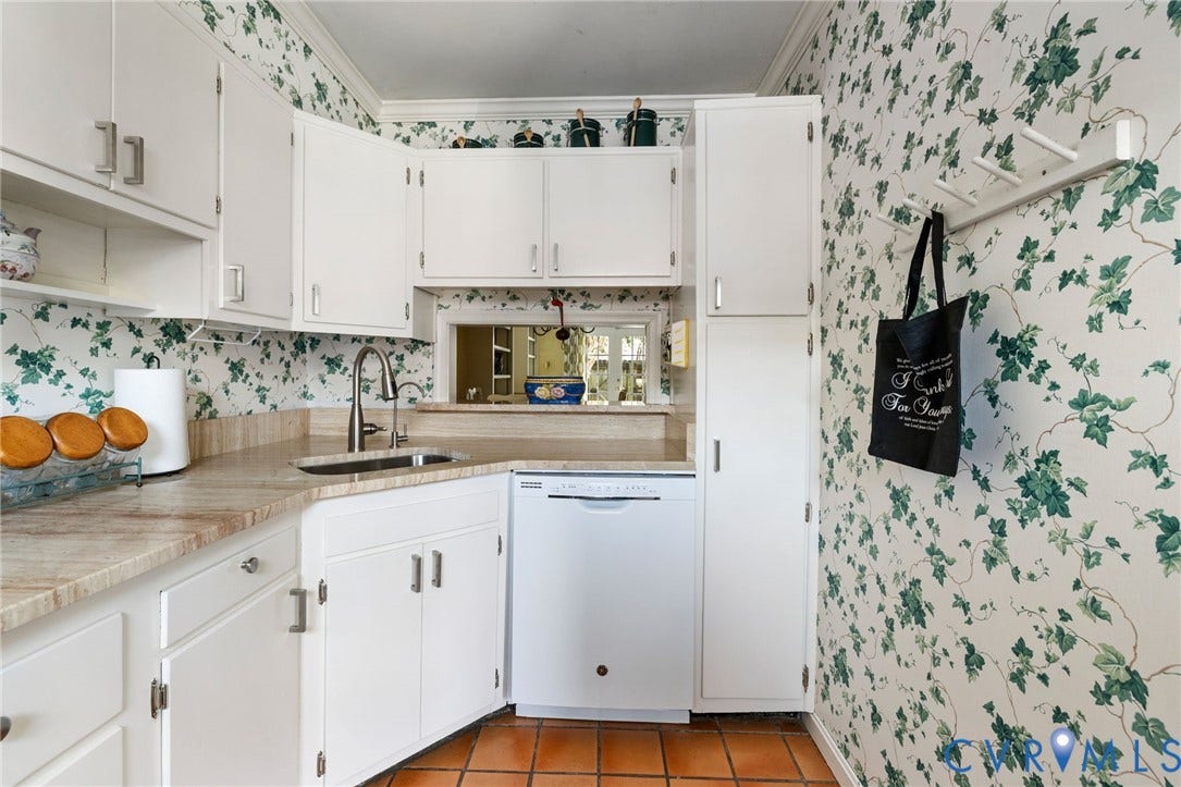 505 N Hamilton Street, #F, Richmond, VA 23221 White cabinetry, integrated dishwasher, stainless steel sink with faucet, terracotta tile flooring, and a pass-through window