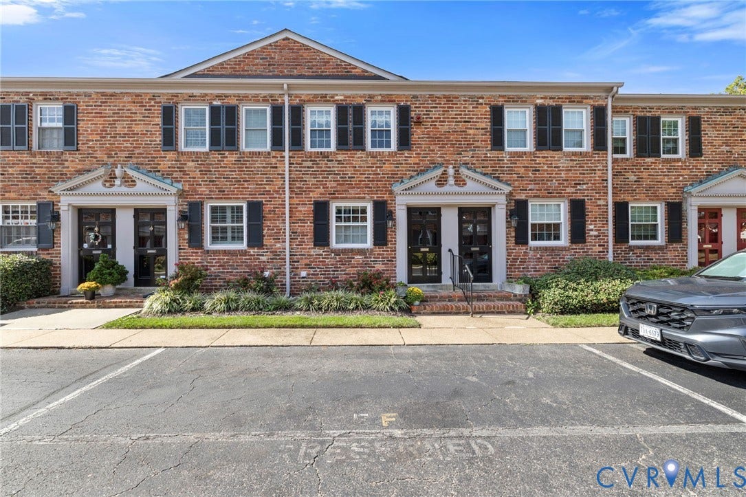 505 N Hamilton Street, #F, Richmond, VA 23221 Brick facade with black shutters, contrasting white window frames, and decorative entryways