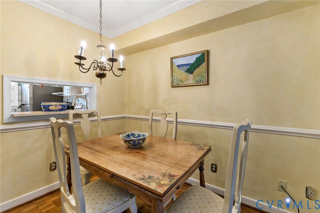 505 N Hamilton Street, #F, Richmond, VA 23221 Pass-through window with a natural stone countertop, crown molding, and parquet wood flooring