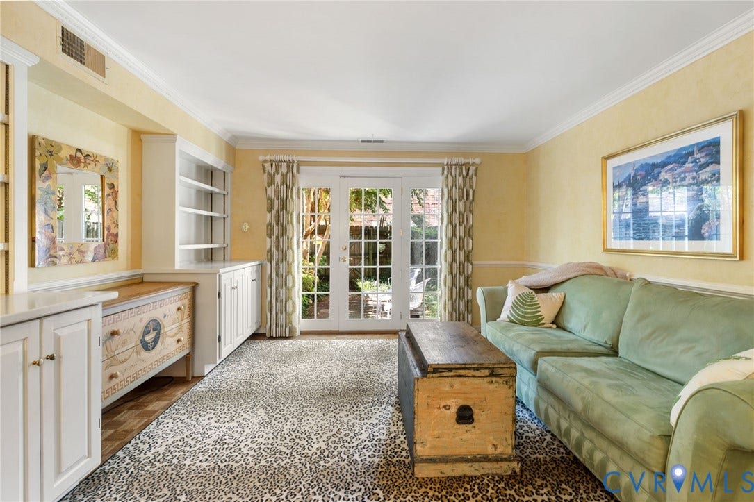 505 N Hamilton Street, #F, Richmond, VA 23221 Built-in cabinetry with shelving, crown molding, and double French doors opening to an outdoor area