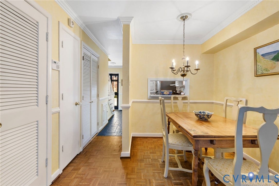 505 N Hamilton Street, #F, Richmond, VA 23221 Dining area with wood-finish flooring, crown molding, and a chandelier