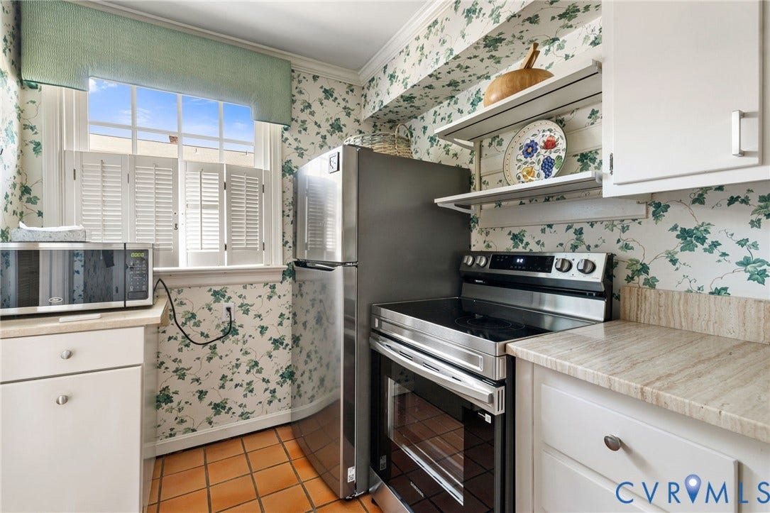 505 N Hamilton Street, #F, Richmond, VA 23221 Tile flooring, stainless steel appliances, white cabinetry, plantation shutters, and stone countertops