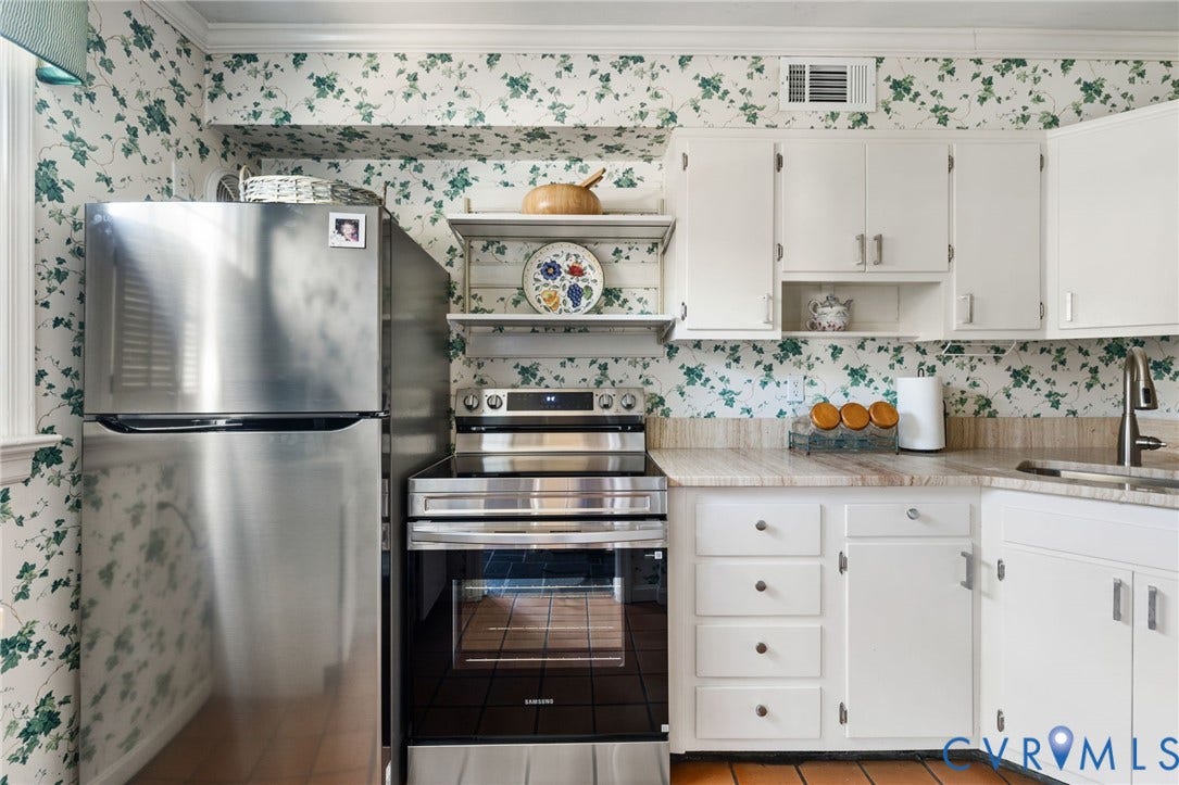 505 N Hamilton Street, #F, Richmond, VA 23221 Stainless steel refrigerator, stainless steel range with oven, built-in white cabinetry, open shelving, and a light-toned countertop