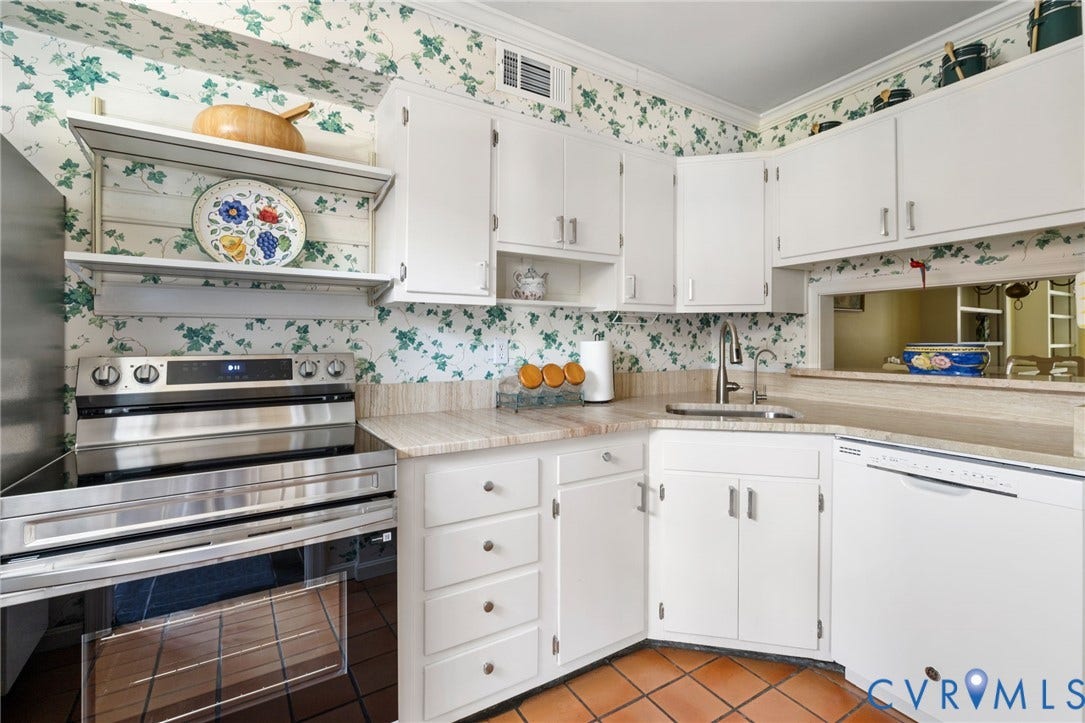 505 N Hamilton Street, #F, Richmond, VA 23221 White cabinetry, stainless steel range, tile flooring, corner sink, and a pass-through window