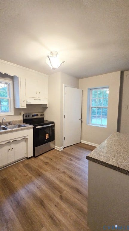 3807 Mooring Way, Chester, VA 23831 Kitchen featuring wood-finish flooring, white cabinetry, a stainless steel range, and a dual basin sink