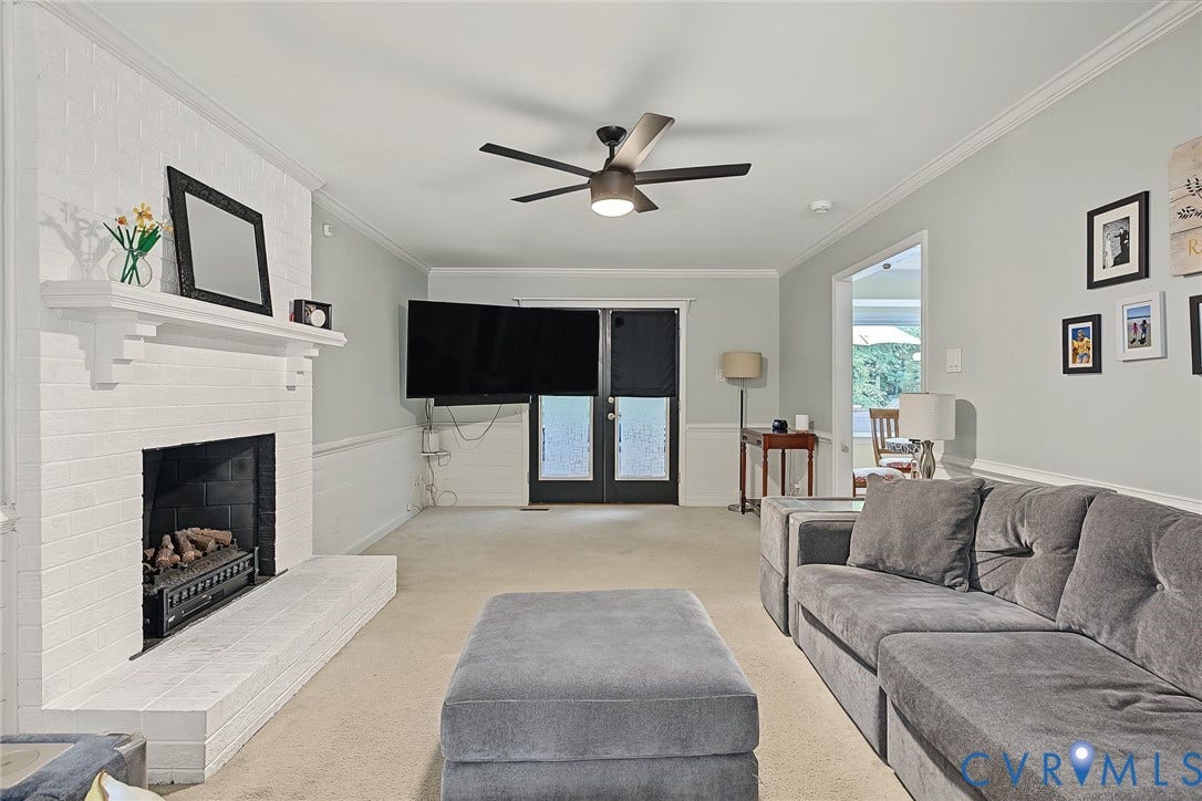 4706 Jacobs Glenn Drive, North Chesterfield, VA 23236 Stretching front to back, with easy access to the kitchen and doors to the screened in porch, accented with classic molding