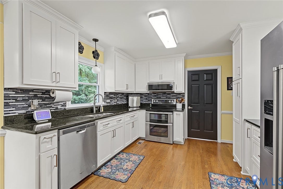 4706 Jacobs Glenn Drive, North Chesterfield, VA 23236 Crisp white cabinets, granite tops, modern backspash, and updated lighting