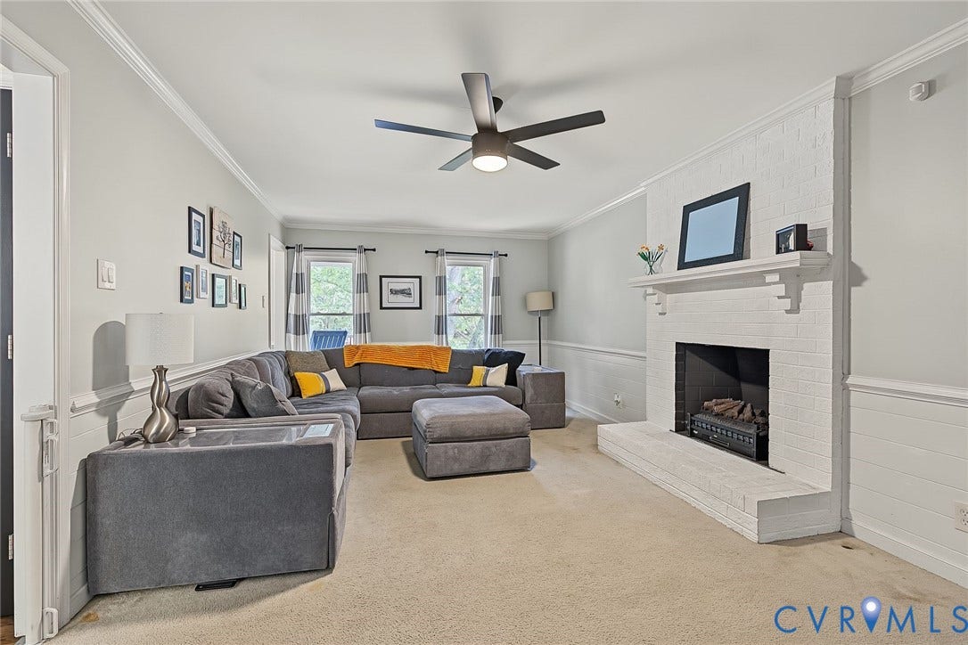 4706 Jacobs Glenn Drive, North Chesterfield, VA 23236 Large enough for all to gather, featuring a brick fireplace with electric insert (plumbed for propane)
