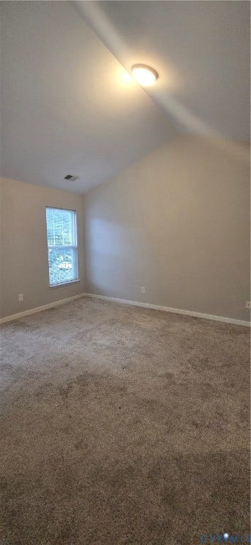 5506 Millwheel Lane, Henrico, VA 23228 Vaulted ceiling featuring a flush-mount light fixture, a window, and neutral-toned carpeting