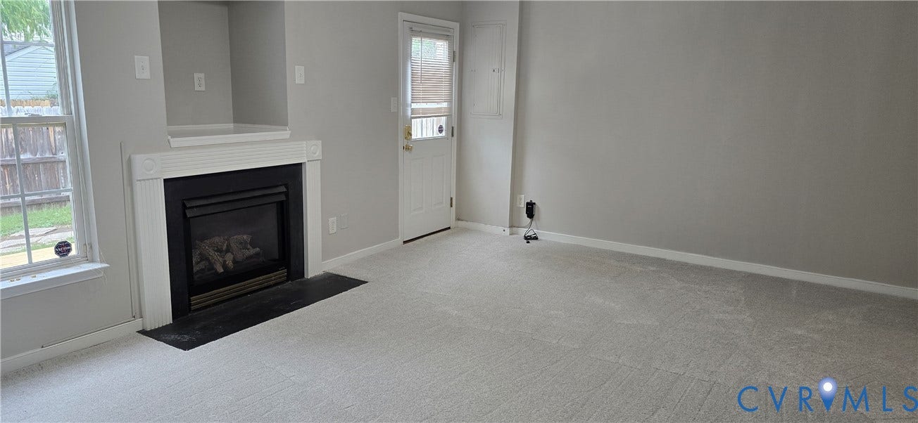 5506 Millwheel Lane, Henrico, VA 23228 Fireplace with a white mantel, light gray walls, and light-colored carpeting