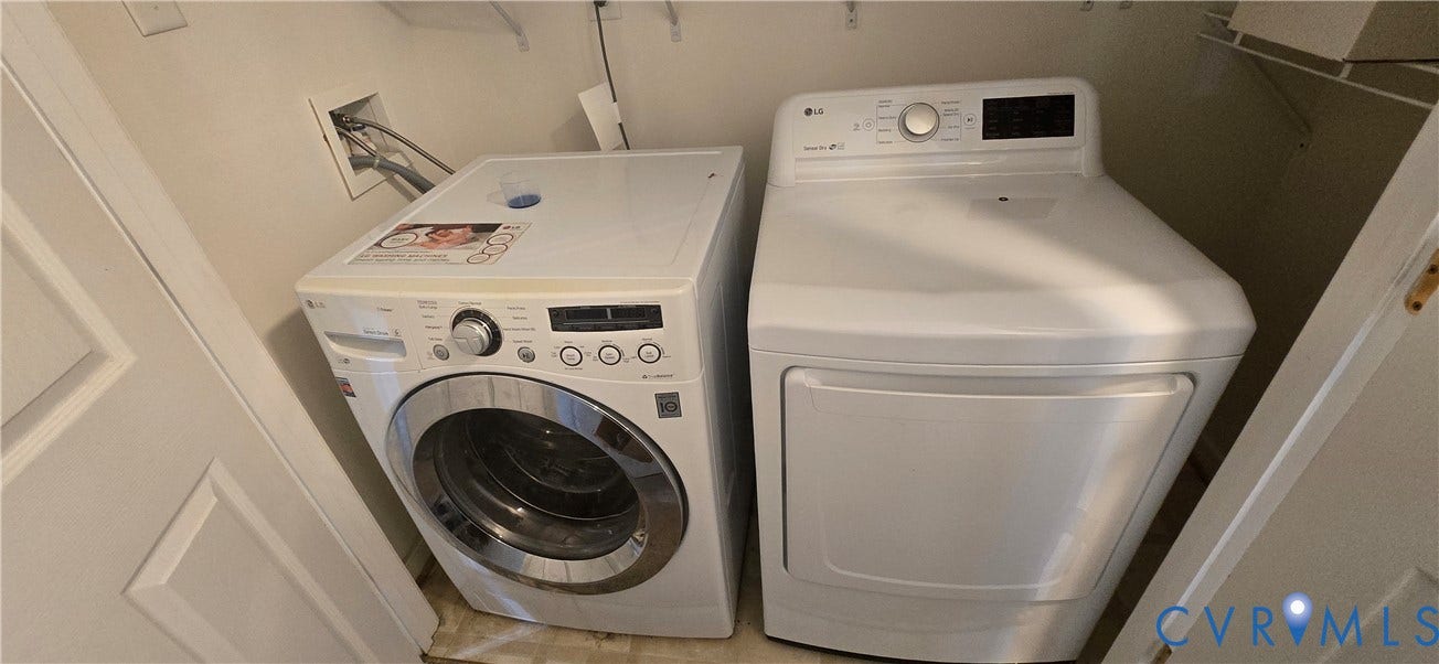 5506 Millwheel Lane, Henrico, VA 23228 Dedicated laundry area featuring a front-load washer and dryer set, with built-in wire shelving