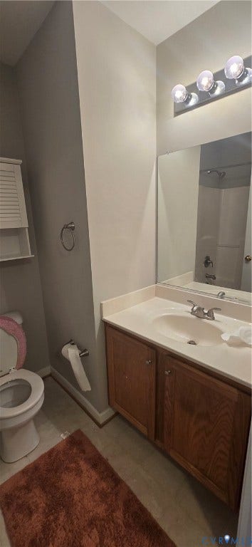 5506 Millwheel Lane, Henrico, VA 23228 Vanity with integrated sink, wood-finish cabinetry, and chrome fixtures