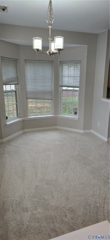 5506 Millwheel Lane, Henrico, VA 23228 Bay window featuring three windows with blinds, overhead chandelier with three frosted glass shades, and light-toned wall-to-wall carpeting