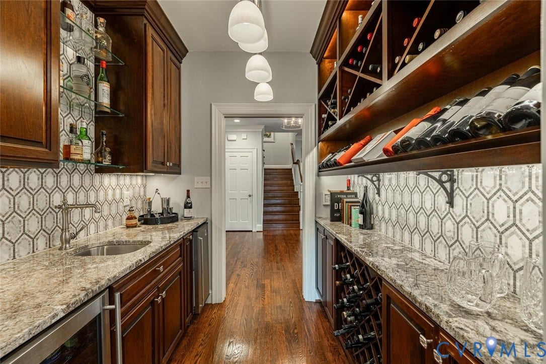 Wet Bar with granite and mosaic backsplash