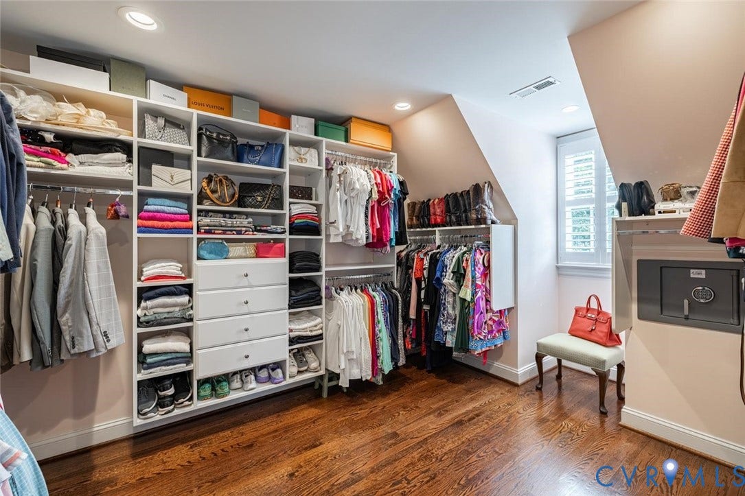 Primary Bedroom closet with amazing hanging and storage space
