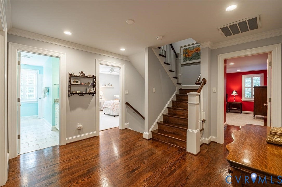 Wide hallway on second  floor with gorgeous floors