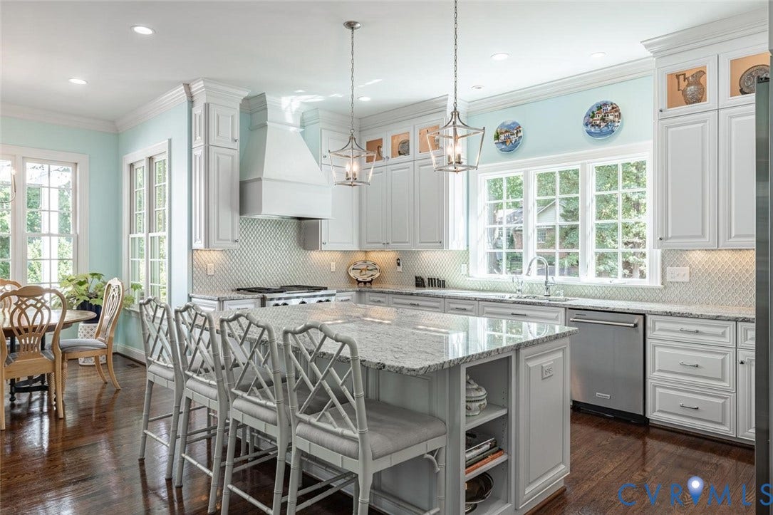Granite counters, glass tile backsplash, oversized island