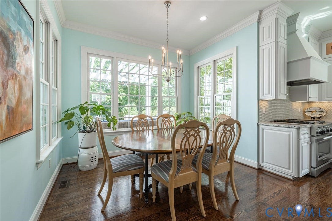 Large dining area flanked by windows