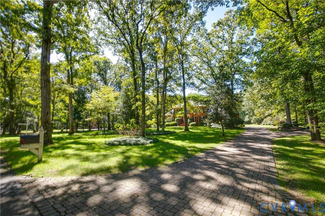 2621 Glenalmond Court, Powhatan, VA 23139 Paver driveway framed by mature trees and manicured lawn