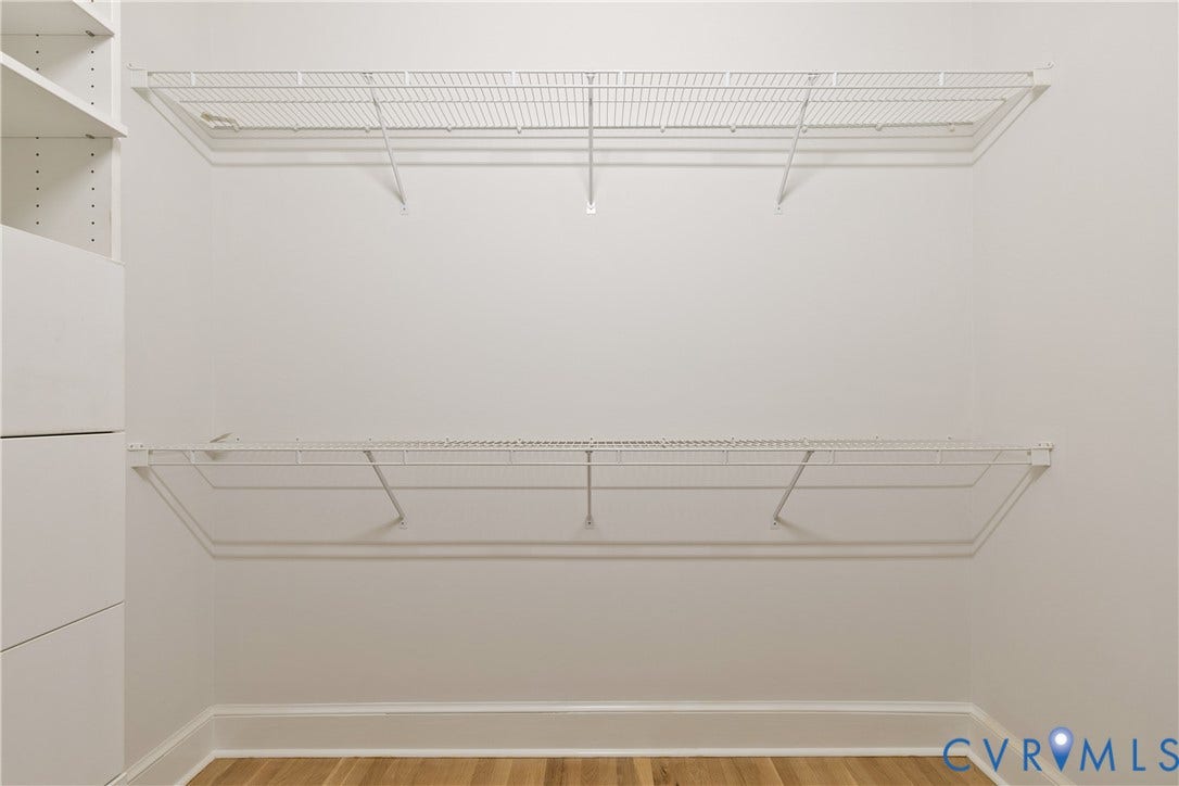 2621 Glenalmond Court, Powhatan, VA 23139 Integrated wire shelving, built-in white cabinetry, and wood-finish flooring