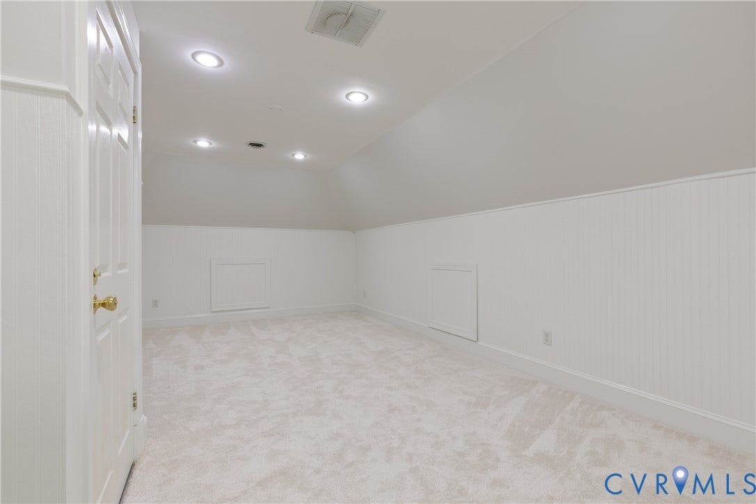 2621 Glenalmond Court, Powhatan, VA 23139 Sloped ceiling with recessed lighting, wall paneling, and light-toned carpeting