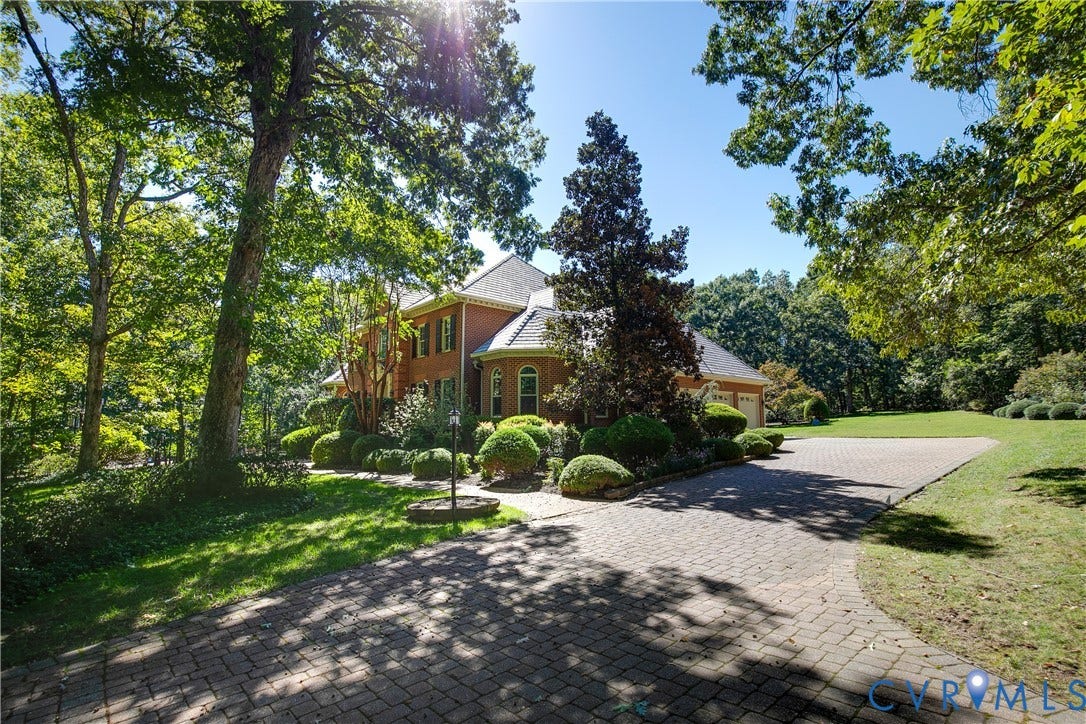 2621 Glenalmond Court, Powhatan, VA 23139 Brick exterior with a gabled roof and arched windows