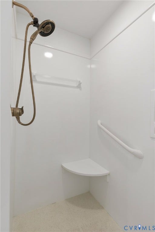 2621 Glenalmond Court, Powhatan, VA 23139 Shower with bronze-finish fixtures, white wall panels, built-in corner seat, and grab bar