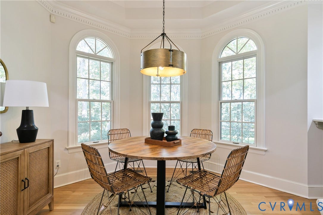 2621 Glenalmond Court, Powhatan, VA 23139 Hardwood flooring, arched windows, decorative crown molding, recessed ceiling, and a contemporary chandelier