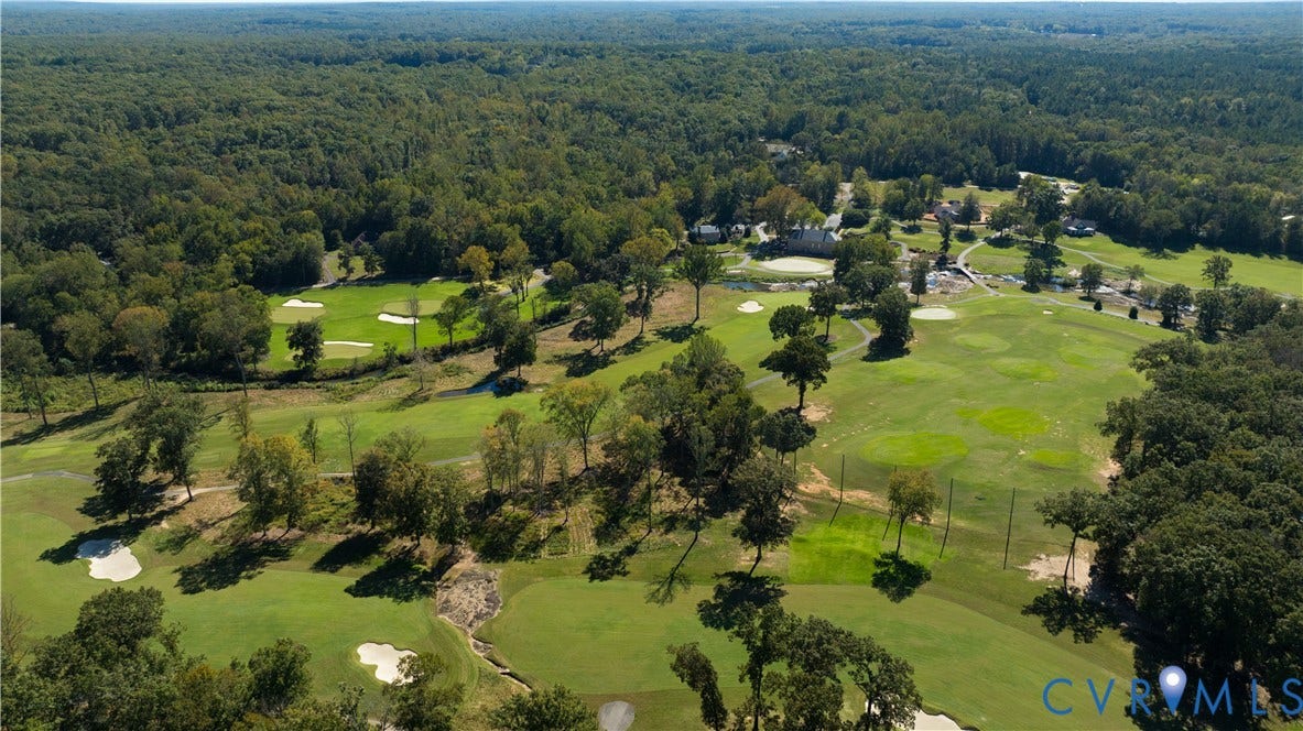 2621 Glenalmond Court, Powhatan, VA 23139 Expansive golf course setting featuring manicured greens, sand traps, mature trees, and a distant building structure