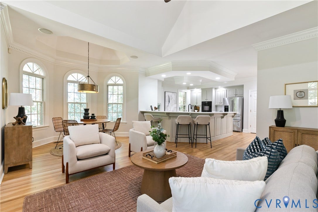 2621 Glenalmond Court, Powhatan, VA 23139 Open-concept living area featuring light wood-finish flooring, recessed lighting, and crown molding