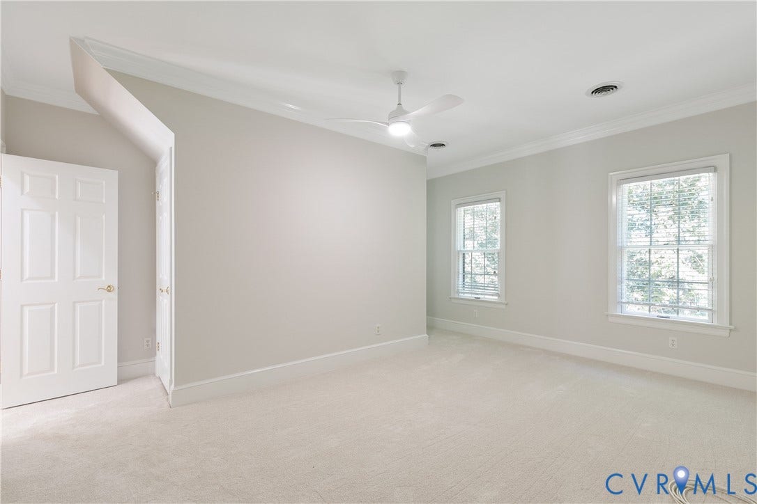 2621 Glenalmond Court, Powhatan, VA 23139 Carpeted room featuring two double-hung windows, a ceiling fan, and crown molding