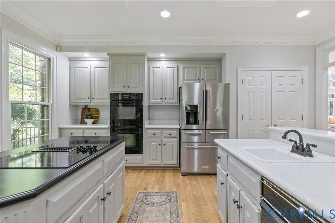 2621 Glenalmond Court, Powhatan, VA 23139 Kitchen featuring wood-finish flooring, white cabinetry, stainless steel appliances, a built-in double oven, and recessed lighting