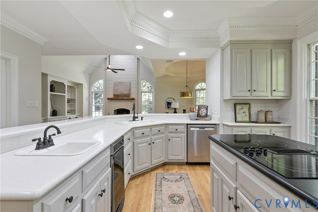 2621 Glenalmond Court, Powhatan, VA 23139 Kitchen featuring white cabinetry, light-colored countertops, wood-finish flooring, a built-in cooktop, and stainless steel appliances